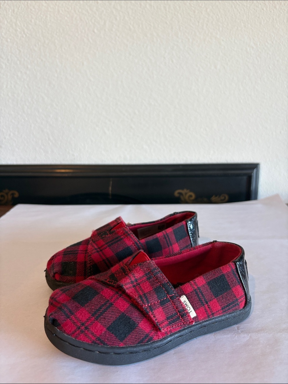 TOMS Black and Red Plaid Slip on shoes
